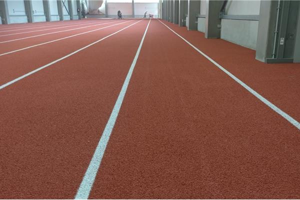 Retopping atletiekpiste indoor - Sportinfrabouw NV